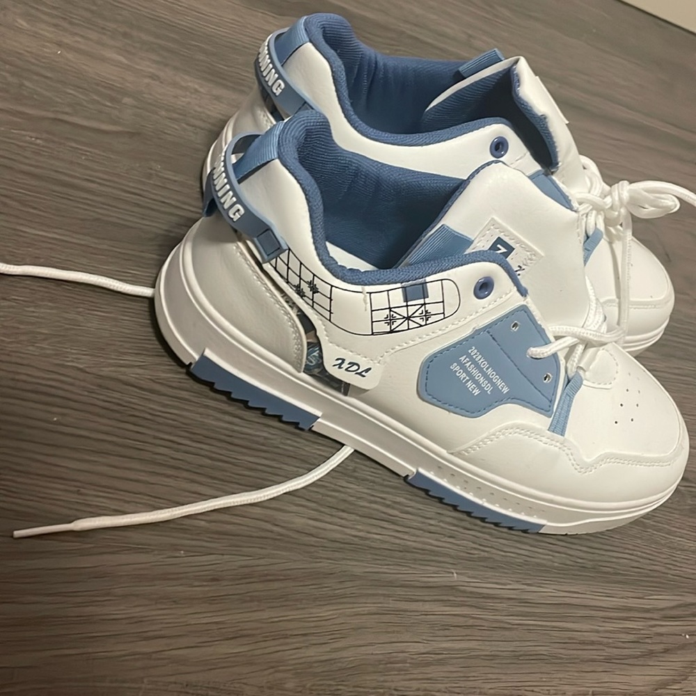 Blue and white new sneakers.Never been worn.Size 42 man